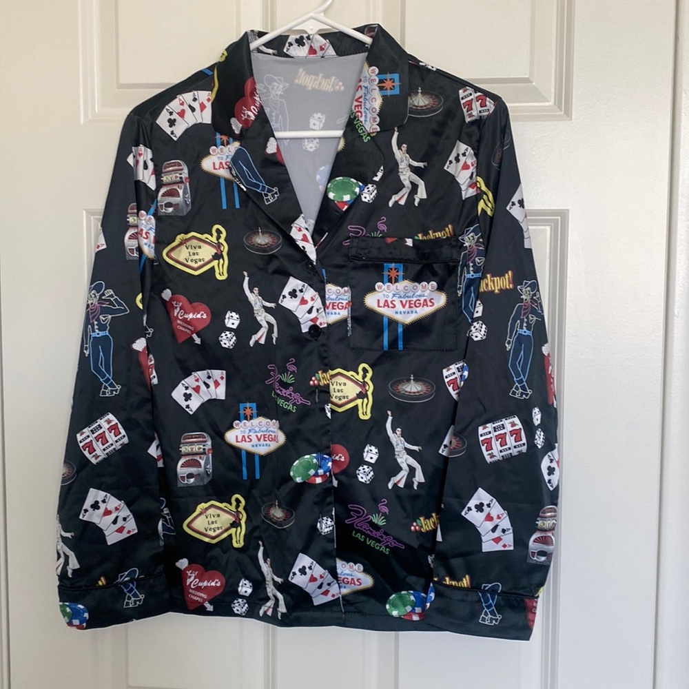 NWOT Vegas themed long sleeve / pants satin pajamas. Size XS